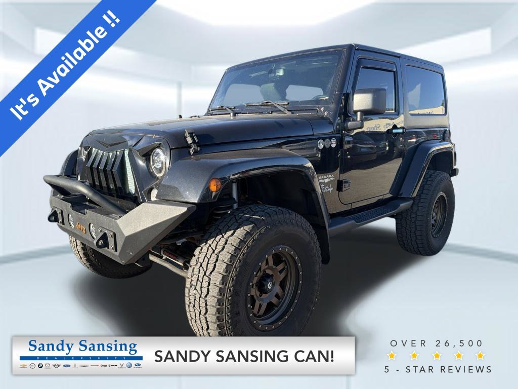 Used 2015 Black Clearcoat Jeep Sahara image 1