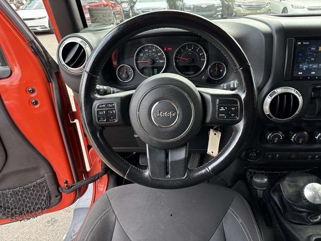 Used 2015 Orange Jeep Sahara image 16