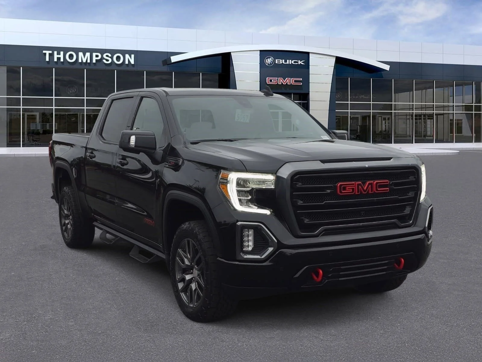 Used 2021 EBONY TWILIGHT METALLIC GMC AT4 image 1