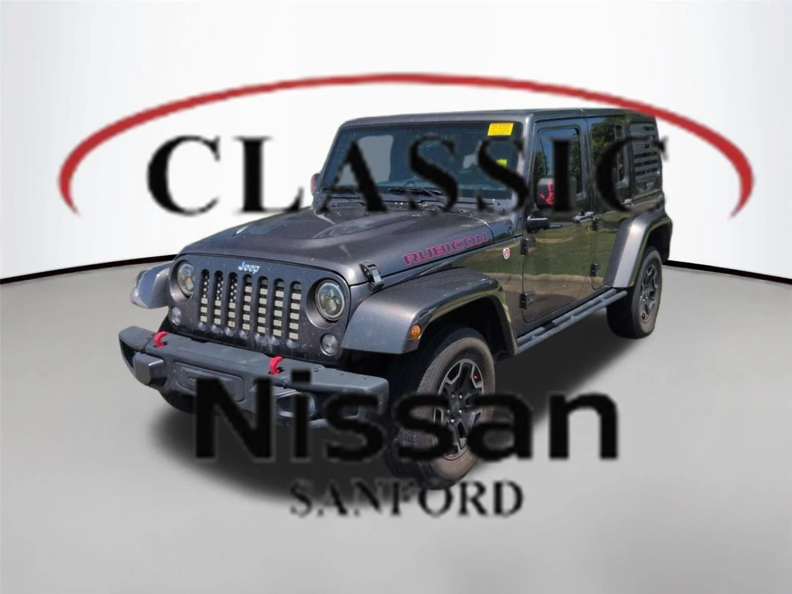 Used 2016 Granite Crystal Metallic Clearcoat Jeep Rubicon Hard Rock image 1