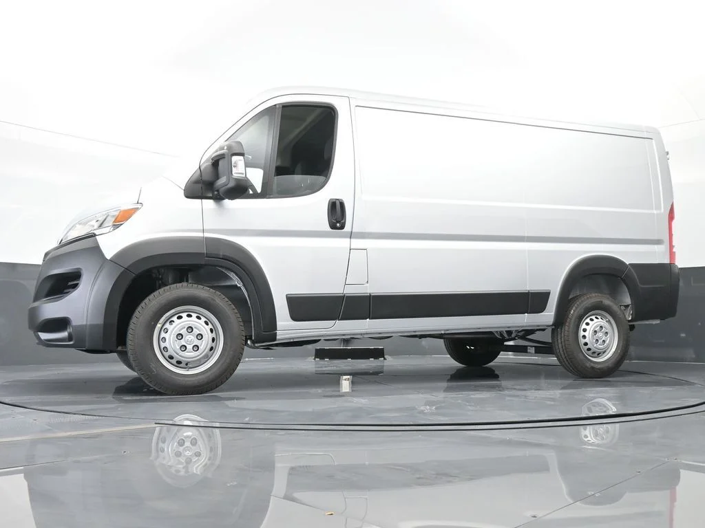 Used 2025 Bright Silver Clearcoat Metallic Ram Low Roof image 48