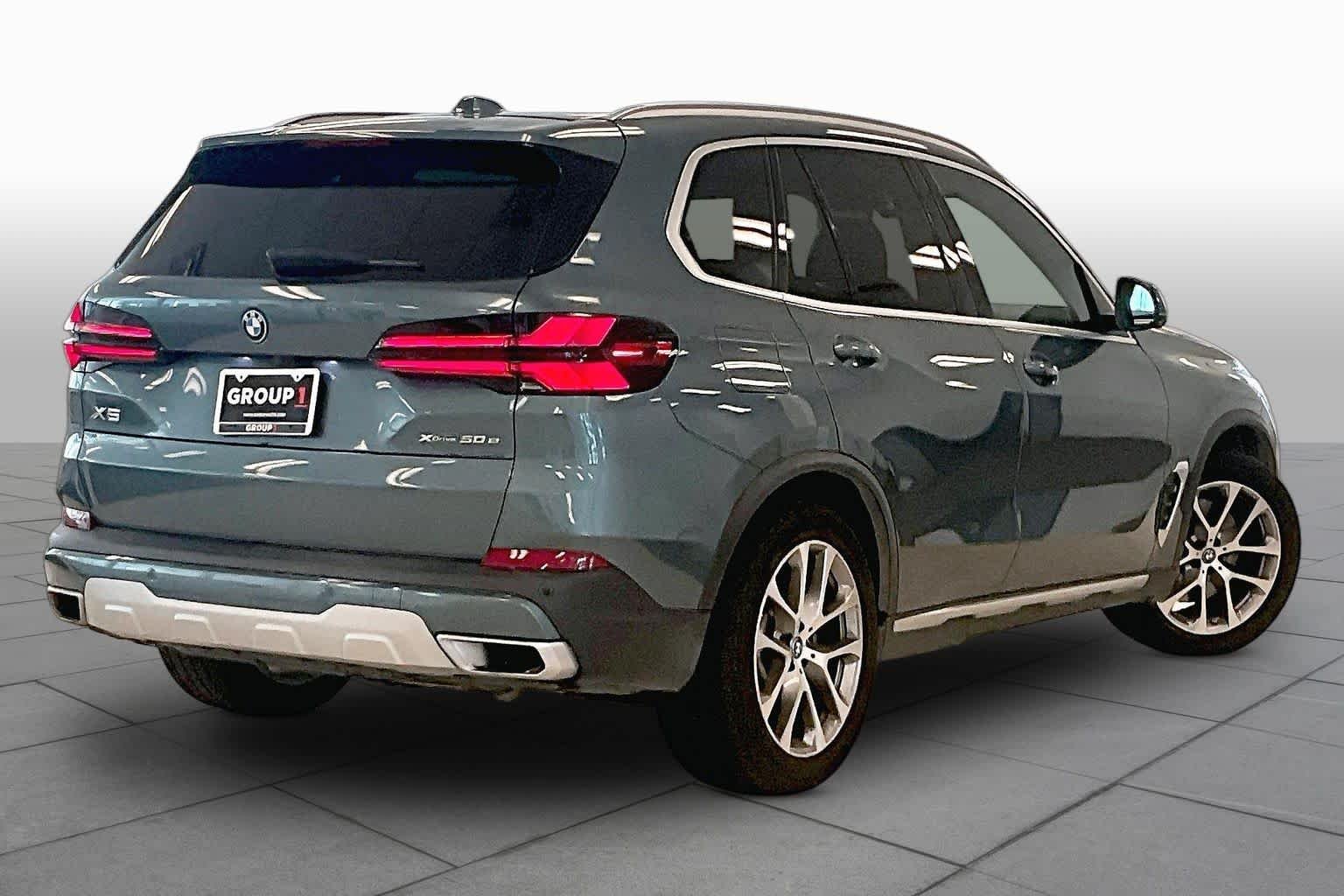 Used 2024 Blue Ridge Mountain Metallic BMW xDrive50e image 12