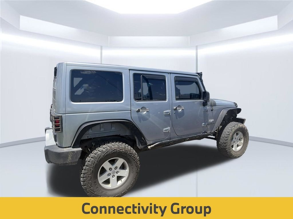 Used 2014 Billet Metallic Clearcoat Jeep Unlimited Sahara image 5