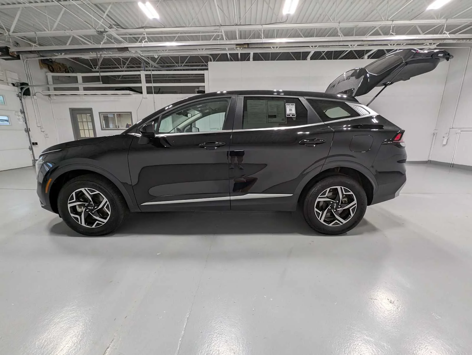 Used 2025 Ebony Black Kia LX image 12