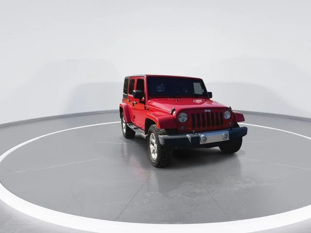 Used 2014 Red Jeep Unlimited Sahara image 2
