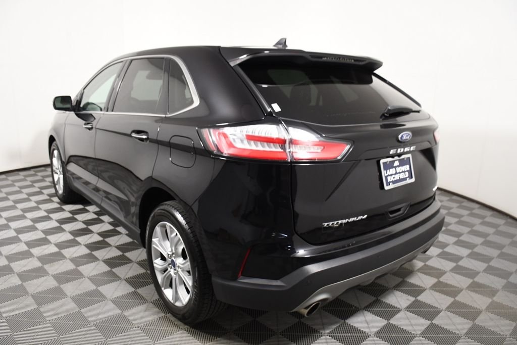 Used 2022 Agate Black Metallic Ford Titanium image 4