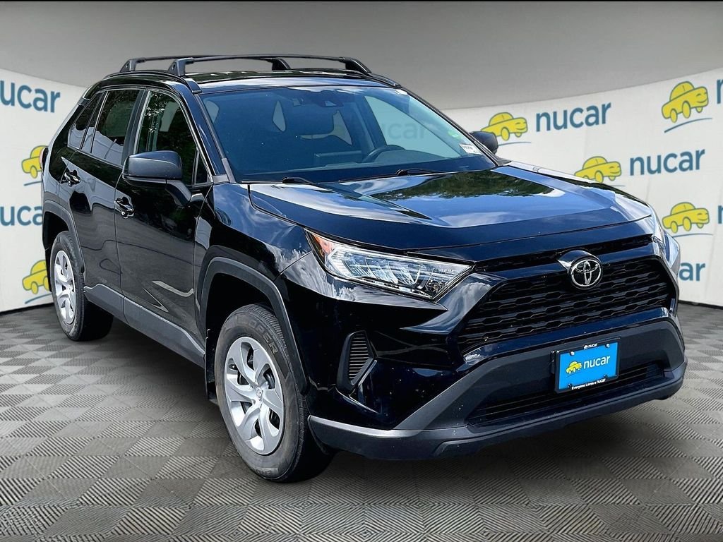 Used 2021 Midnight Black Metallic Toyota LE image 1