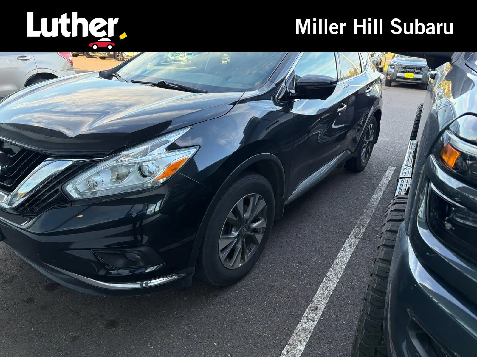 Used 2017 Magnetic Black Metallic Nissan SL image 1