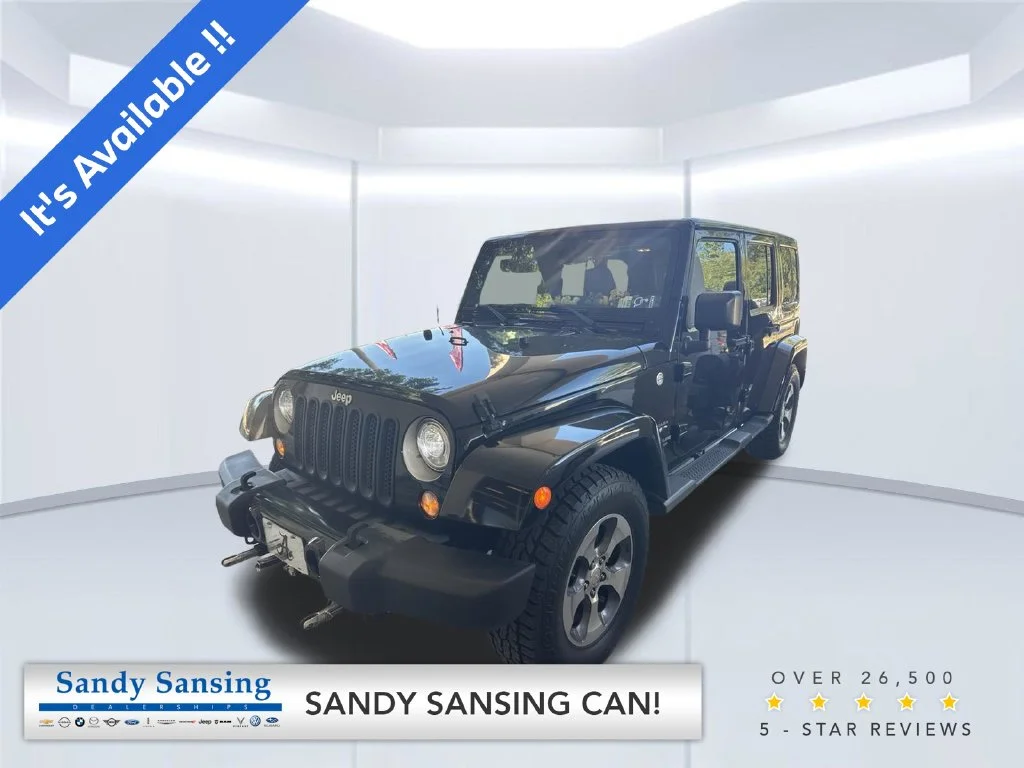 Used 2017 Black Jeep Unlimited Sahara image 1