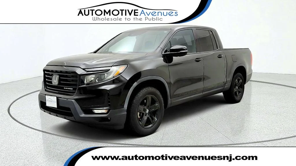 Used 2023 Crystal Black Pearl Honda Black Edition AWD image 1