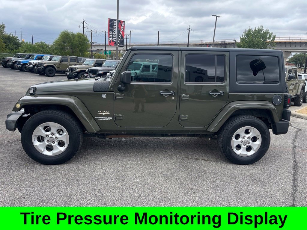 Used 2015 Green Jeep Unlimited Sahara image 4