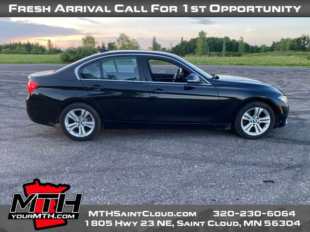 Used 2017 Black BMW 330i xDrive image 1