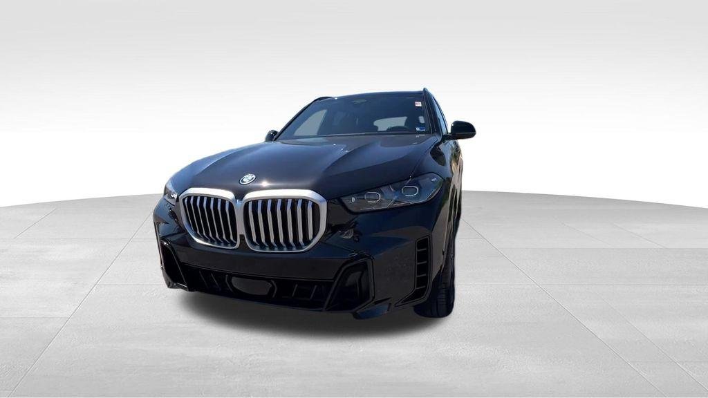 New 2026 Black Sapphire Metallic BMW xDrive50e image 8