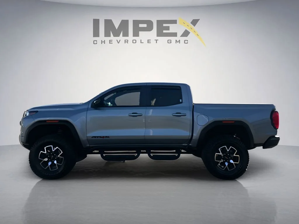 Used 2023 Sterling Metallic GMC AT4X image 2