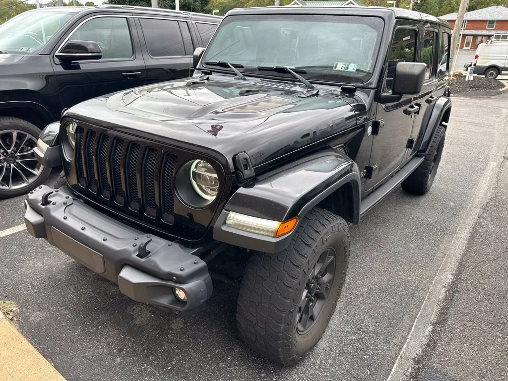 Used 2019 Black Jeep Unlimited Sahara image 1