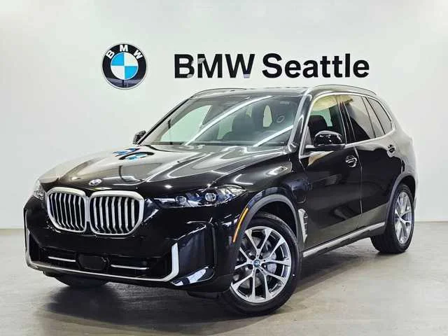 Used 2025 Black Sapphire Metallic BMW xDrive50e image 1