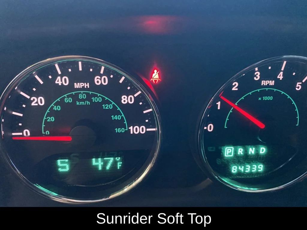 Used 2013 Silver Jeep Sahara image 4