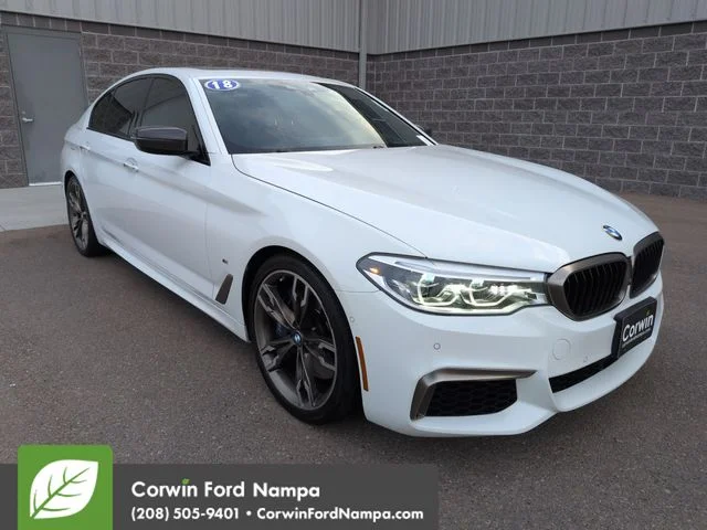 Used 2018 White BMW M550i xDrive image 1