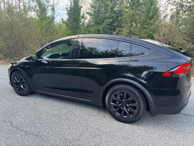 Used 2022 Solid Black Tesla Base image 7