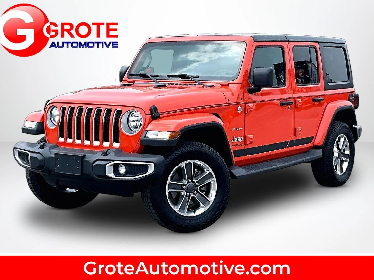 Used 2018 Orange Jeep Unlimited Sahara image 1