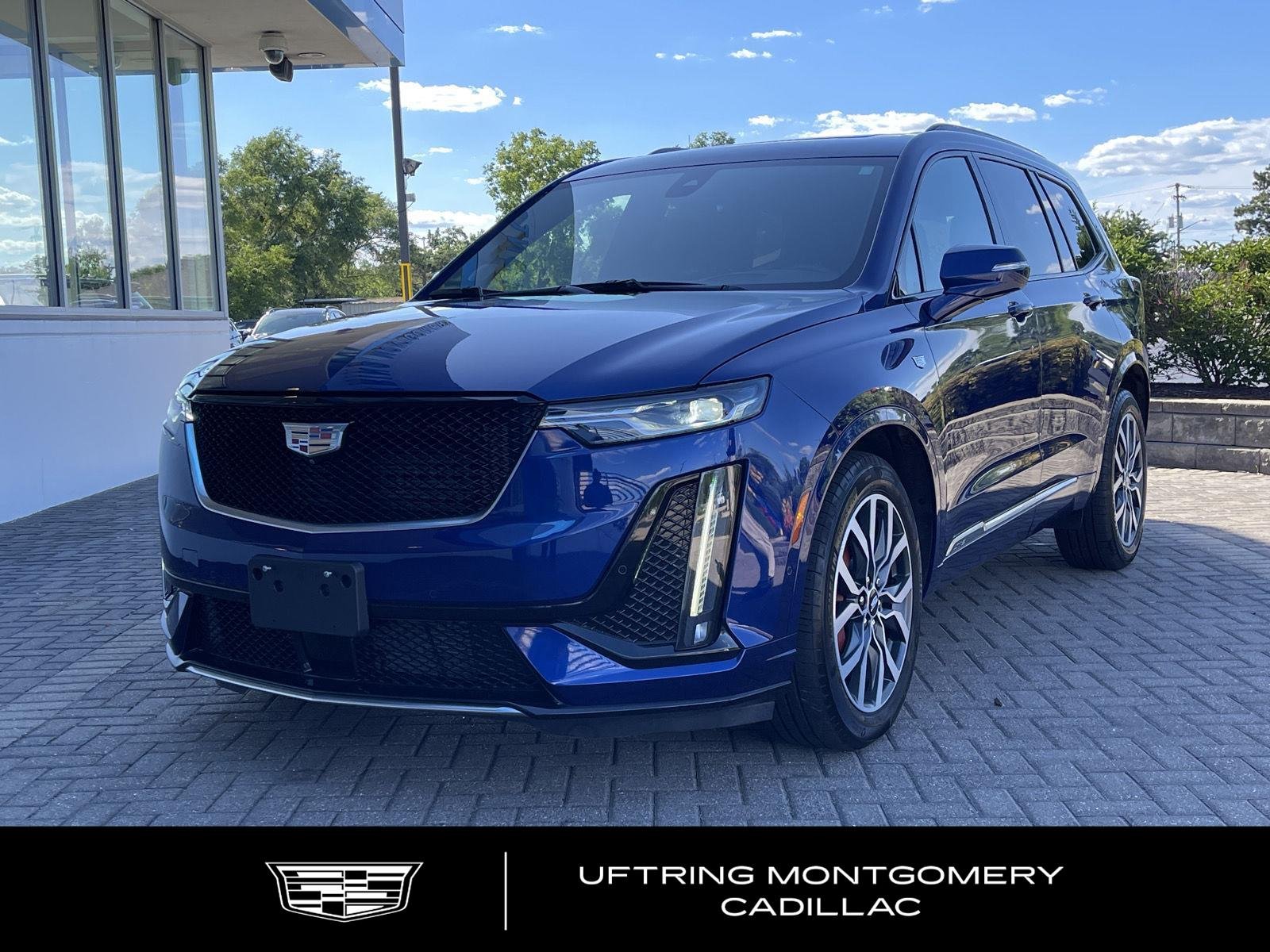 Used 2024 Opulent Blue Metallic Cadillac Sport image 1