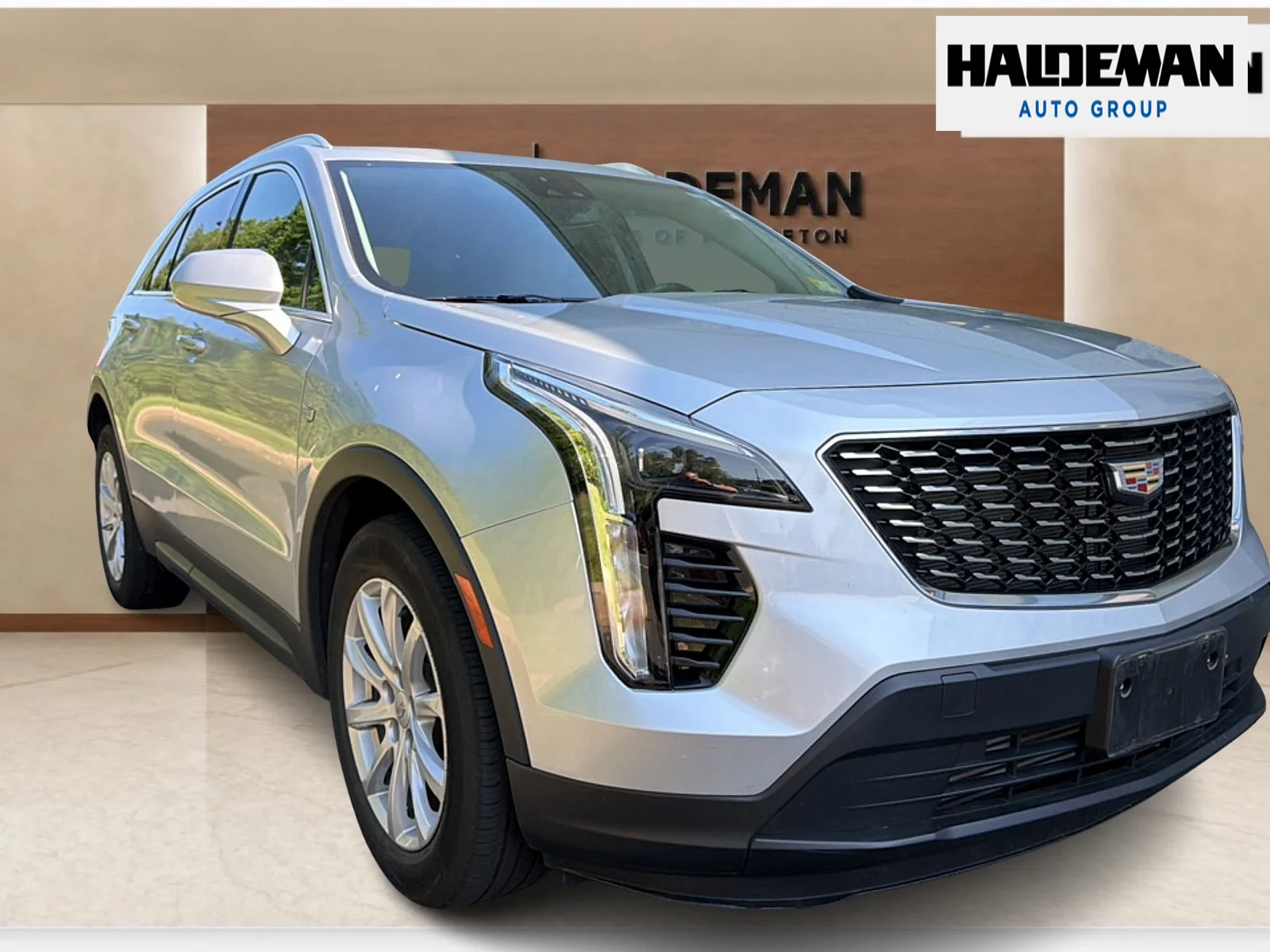 Used 2021 Radiant Silver Metallic Cadillac AWD Luxury image 1