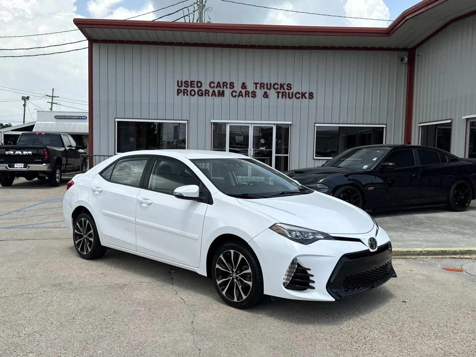 Used 2019 Super White Toyota LE image 1