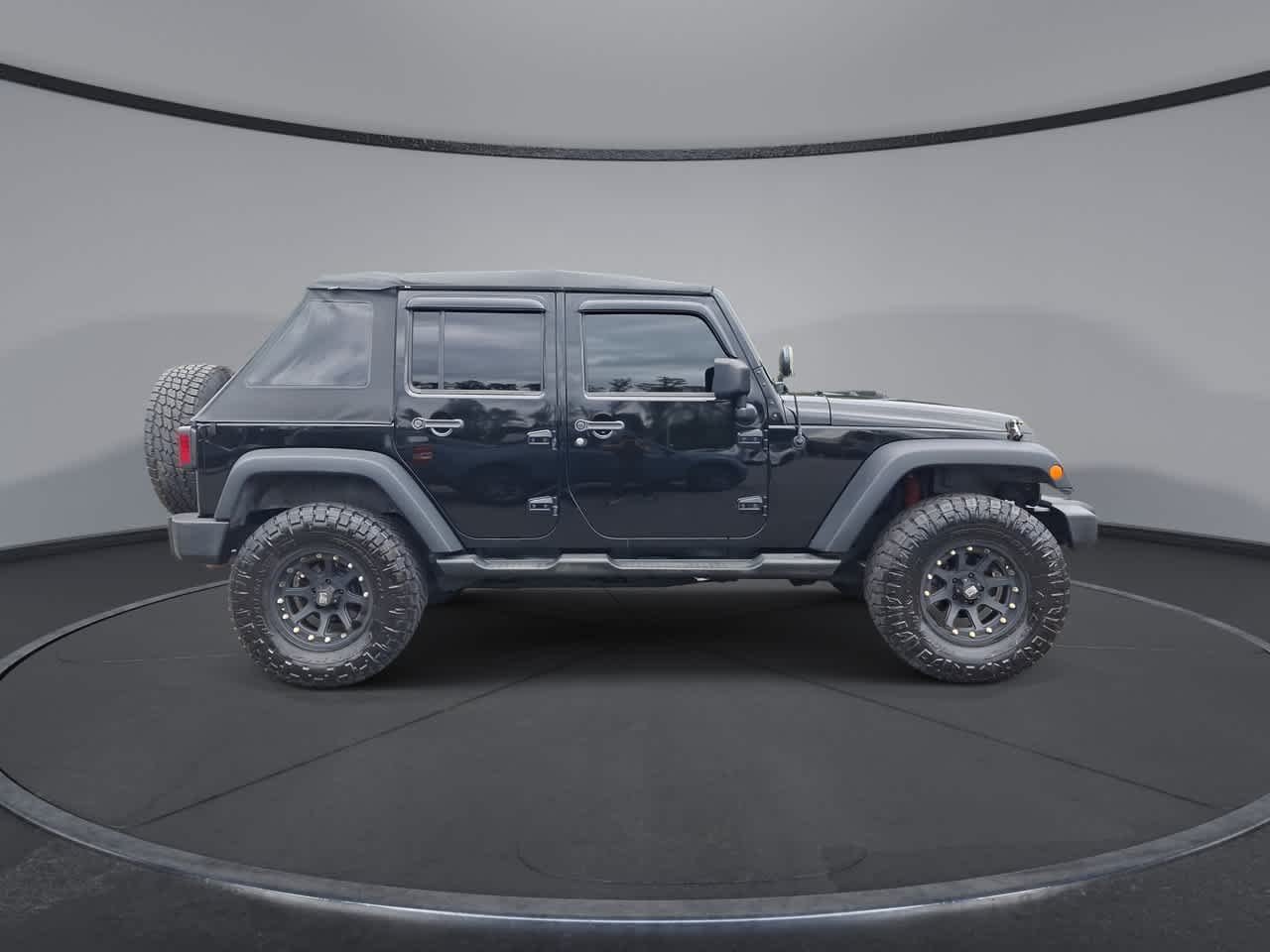 Used 2013 Black Clearcoat Jeep Sport image 9