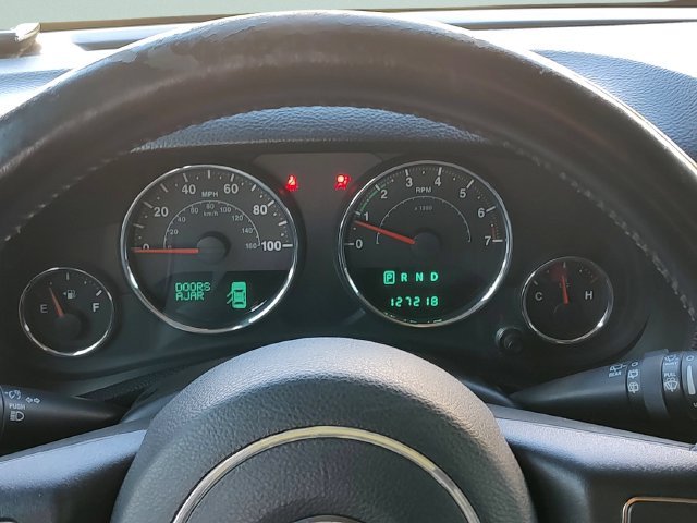 Used 2013 Green Jeep Unlimited Sport image 12