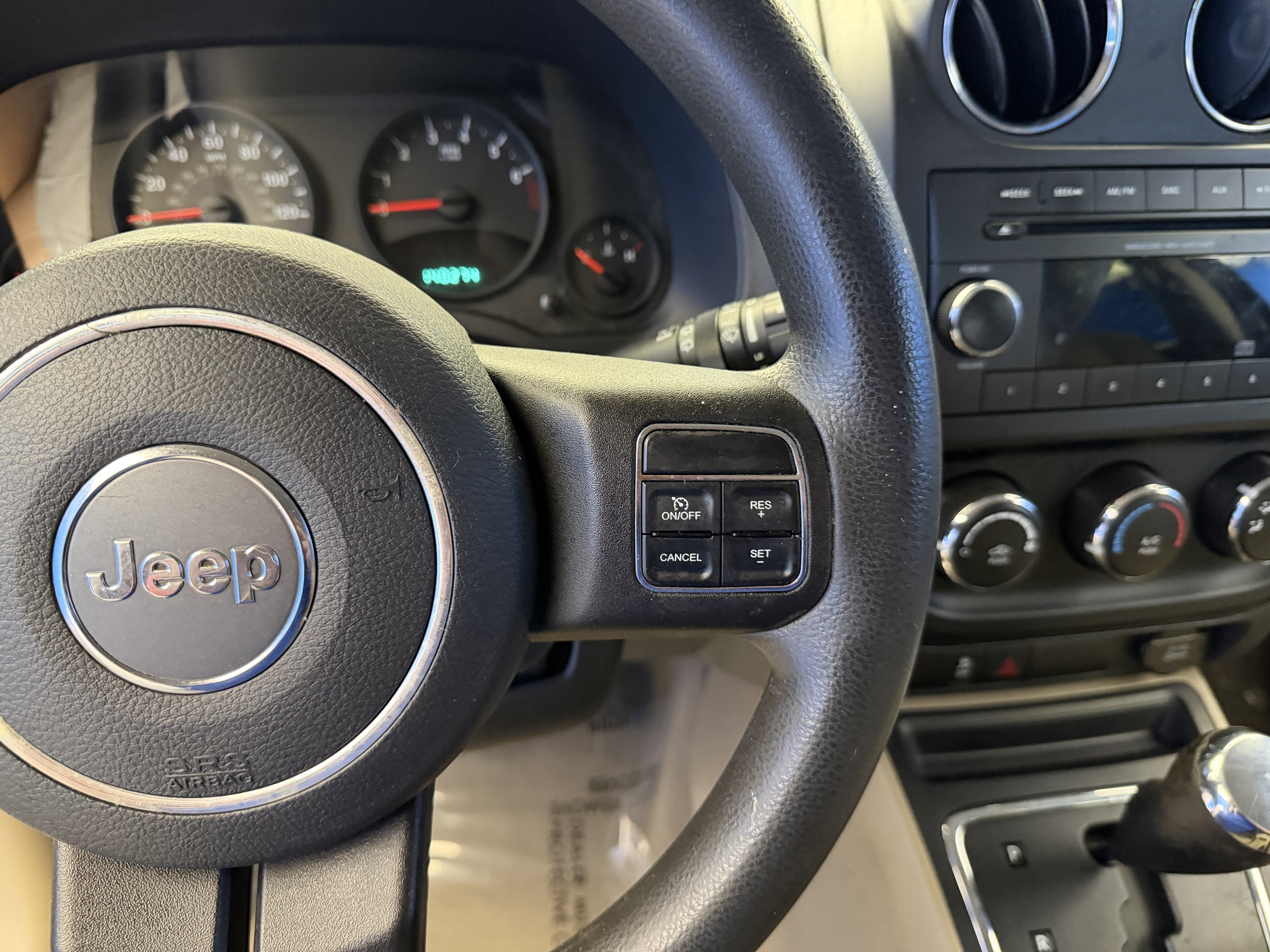 Used 2012 Mineral Gray Metallic Jeep Sport image 14