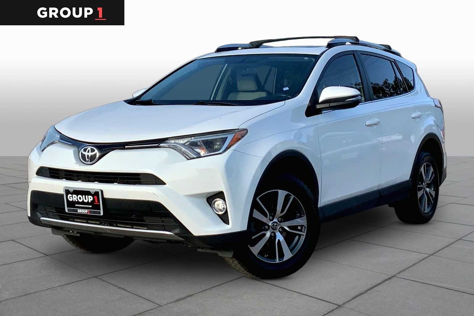 Used 2016 Super White Toyota XLE image 1