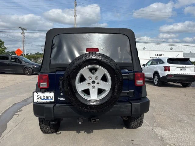 Used 2013 Blue Jeep Unlimited Sport image 6