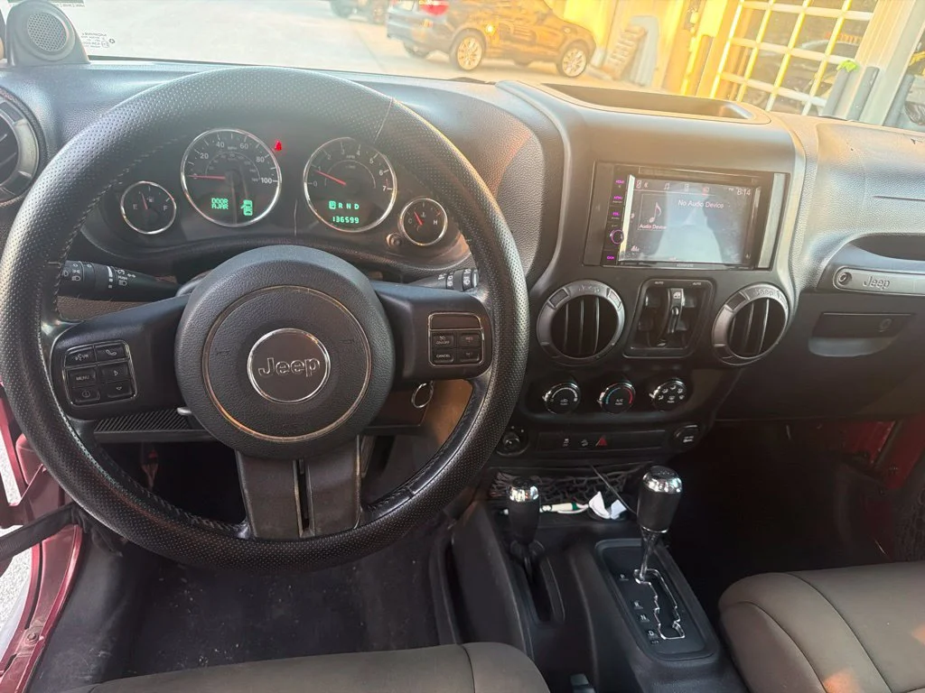 Used 2012 Red Jeep Unlimited Sport S image 9