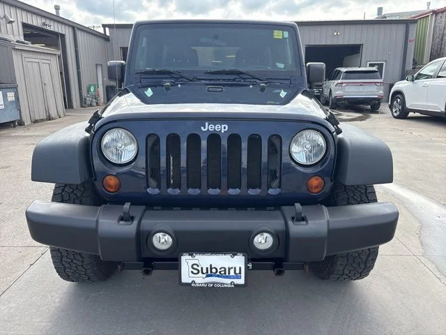 Used 2013 Blue Jeep Unlimited Sport image 2