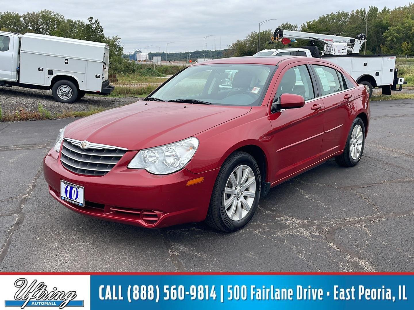 Used 2010 Inferno Red Crystal Pearl Chrysler Limited image 1