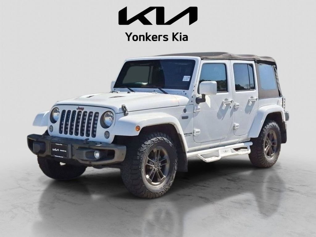 Used 2016 White Jeep Unlimited Sahara image 1