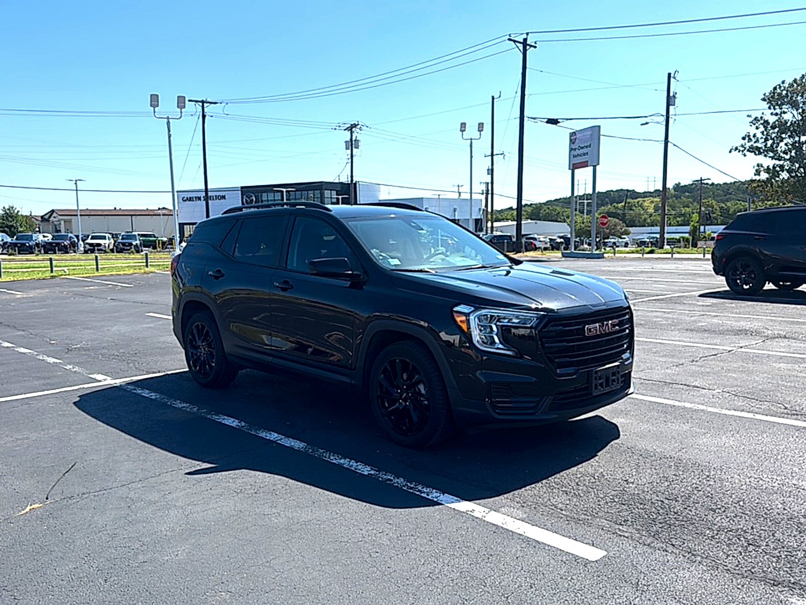 Used 2024 Ebony Twilight Metallic GMC SLE image 4
