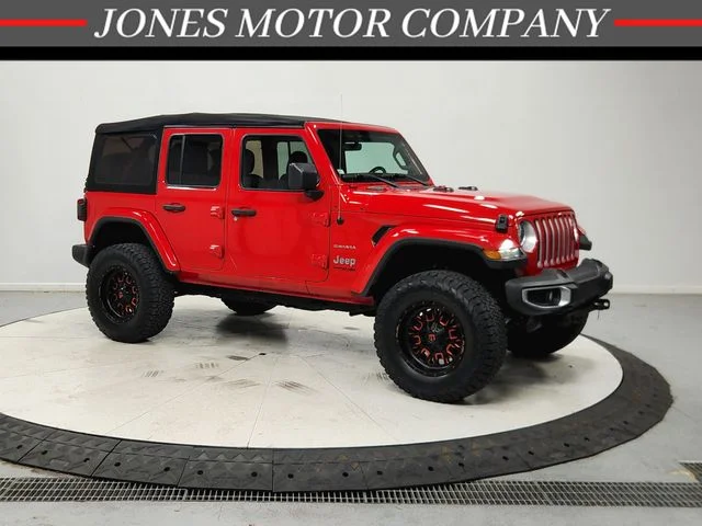 Used 2020 Red Jeep Unlimited Sahara image 1