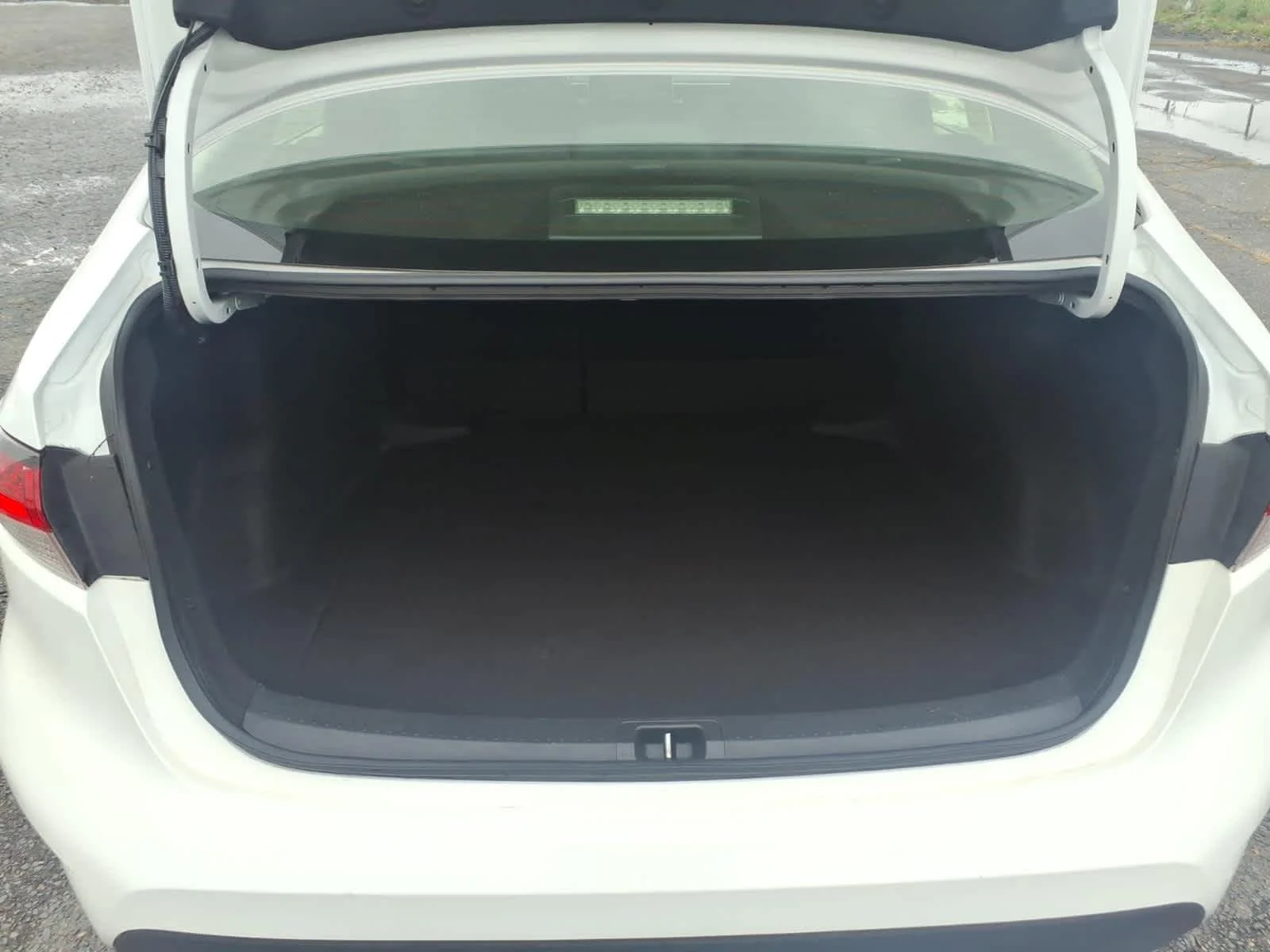 Used 2021 Super White Toyota LE image 10