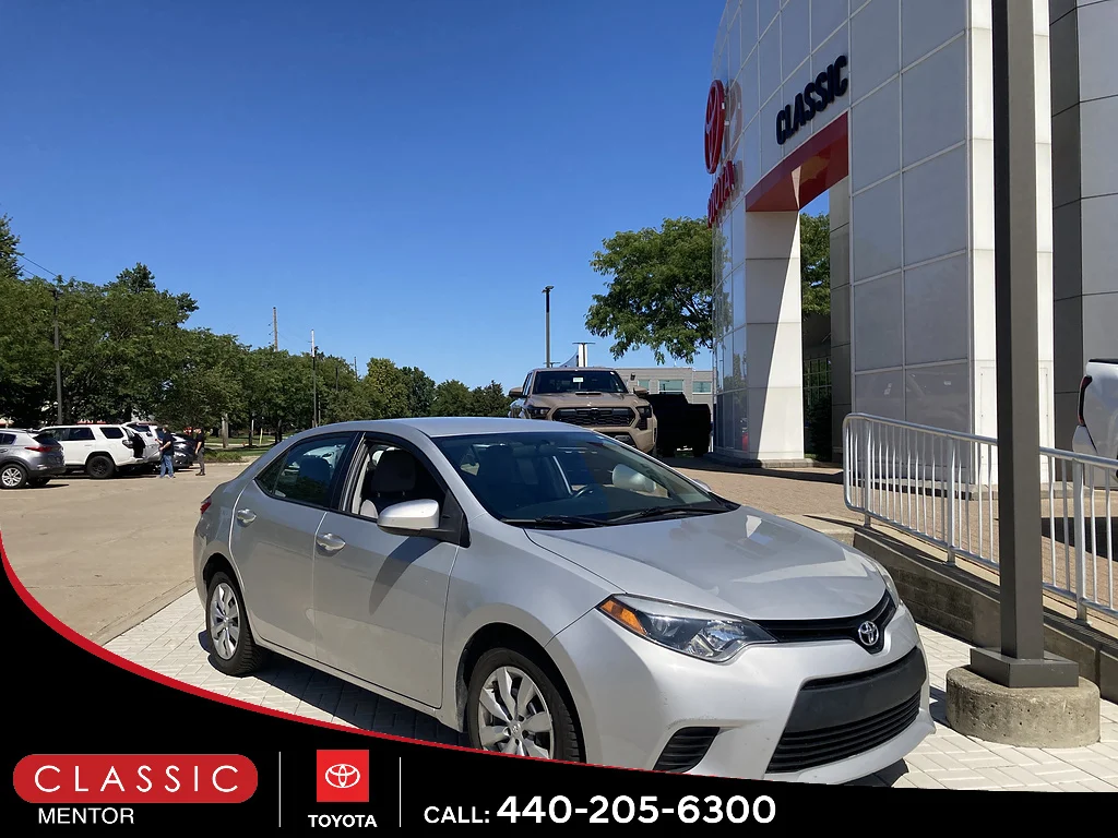 Used 2014 Classic Silver Metallic Toyota LE image 1