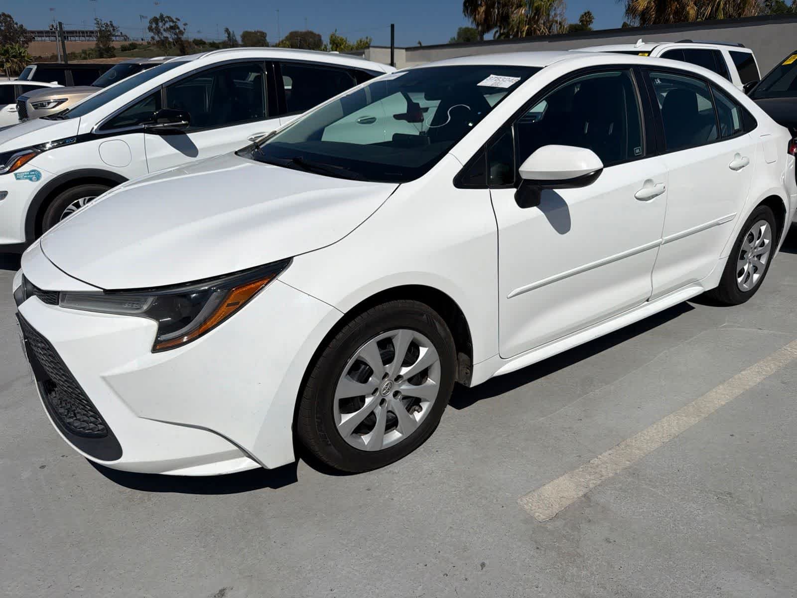 Used 2021 Super White Toyota LE image 1