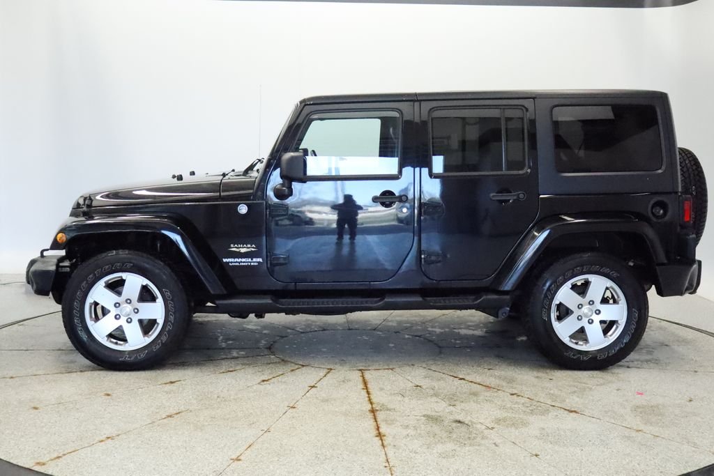 Used 2011 Jeep Wrangler Unlimited Sahara with VIN 1J4HA5H18BL593760 for sale in Coon Rapids, Minnesota