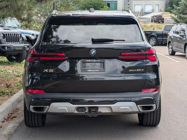 Used 2025 Black Sapphire Metallic BMW xDrive50e image 4