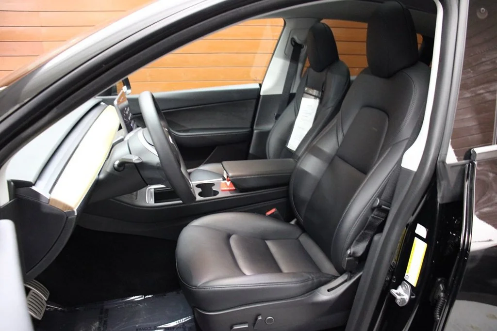 Used 2022 Solid Black Tesla Performance image 19