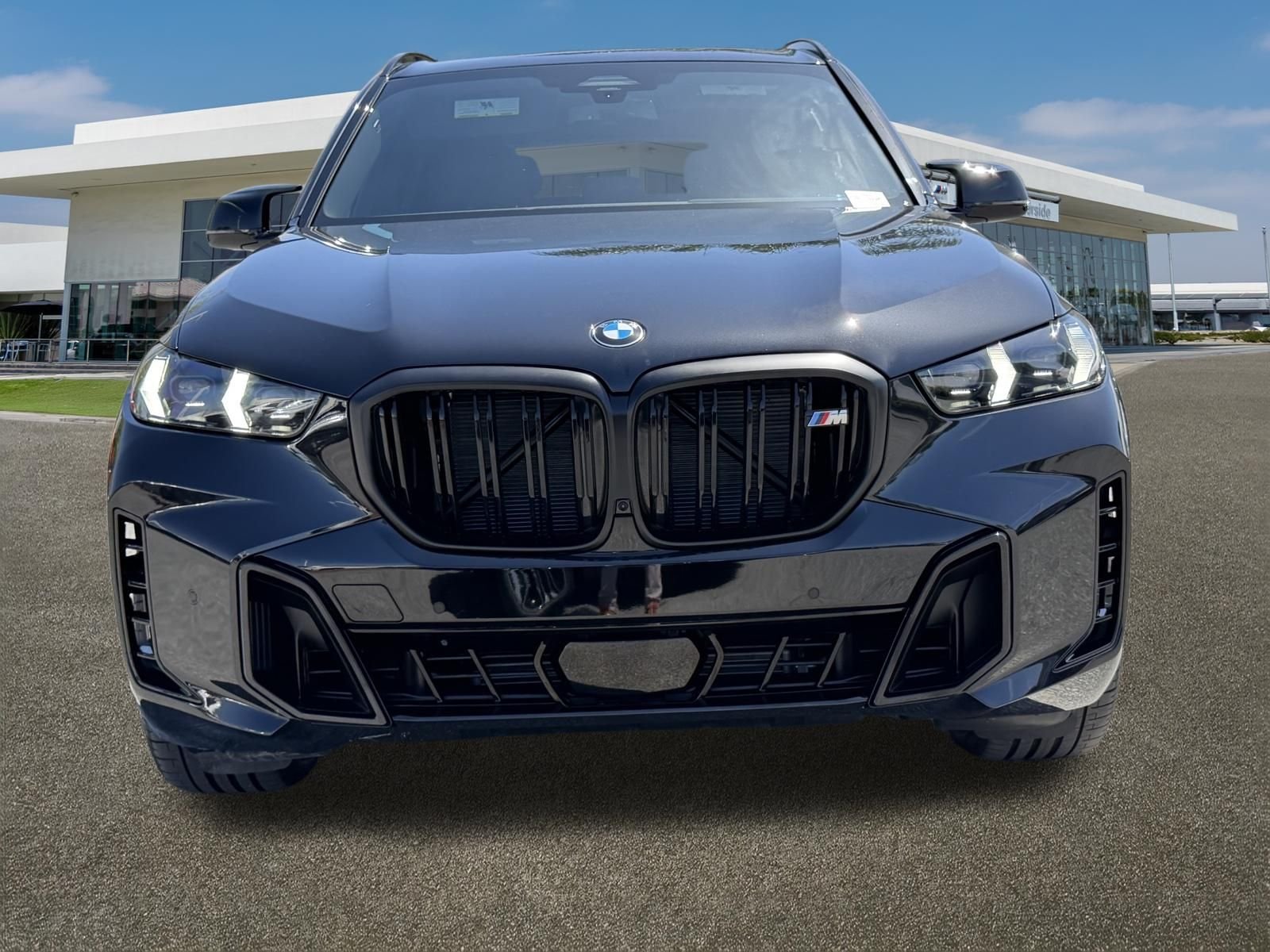 Used 2026 Black Sapphire Metallic BMW M60i image 3