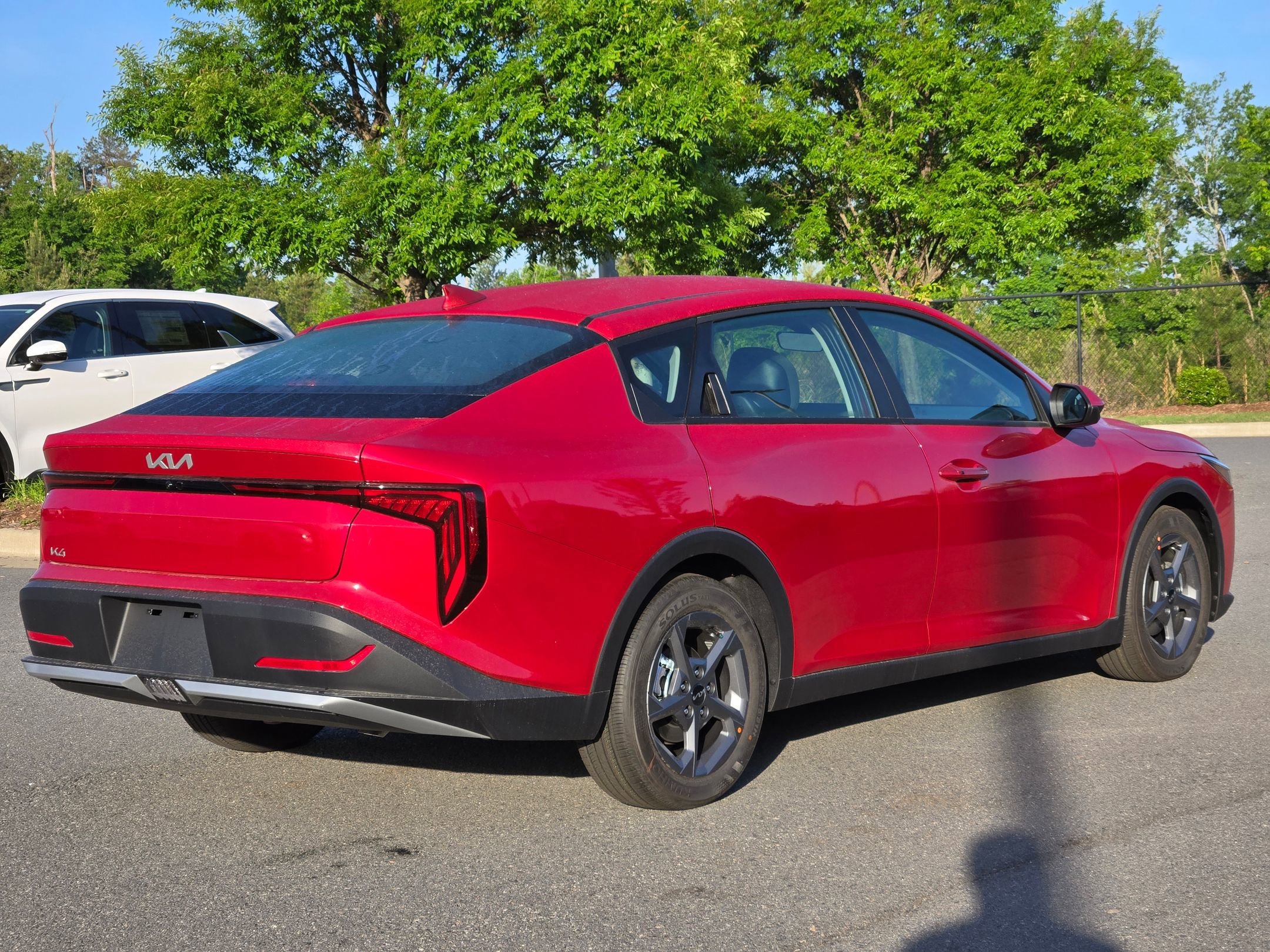 New 2026 Currant Red Kia LXS image 7