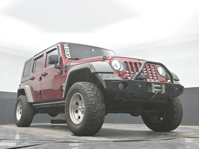 Used 2012 Red Jeep Unlimited Sport image 25