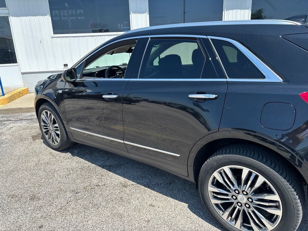 Used 2017 STELLAR BLACK METALLIC Cadillac Premium Luxury AWD image 1