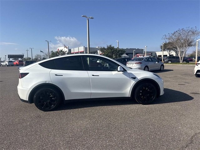 Used 2021 Tesla Model Y Standard Range with VIN 5YJYGDED3MF174525 for sale in Haines City, FL