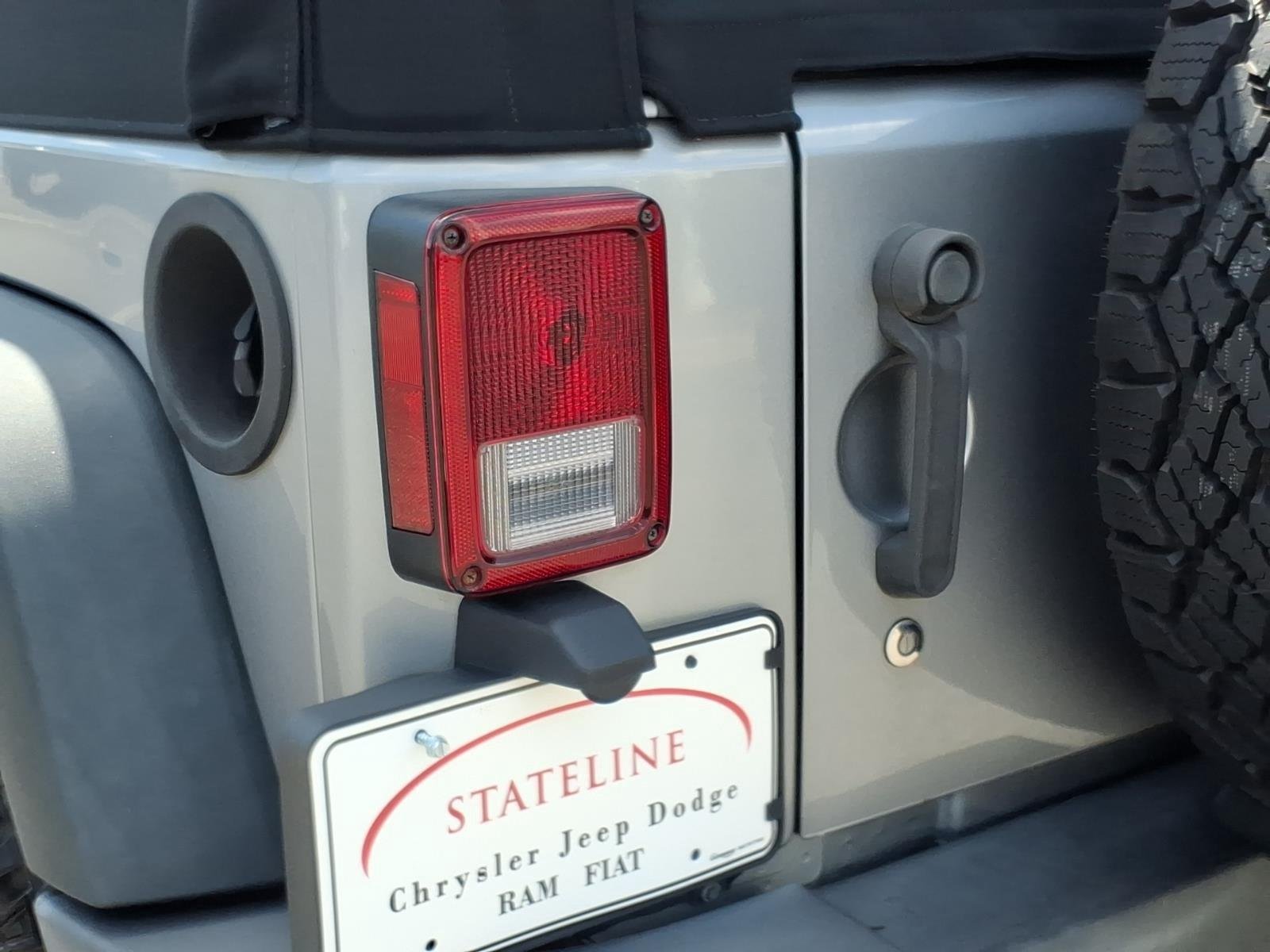 Used 2015 Billet Silver Metallic Clearcoat Jeep Sport image 16